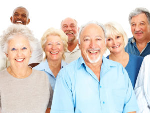 Group of retired people smiling against white background